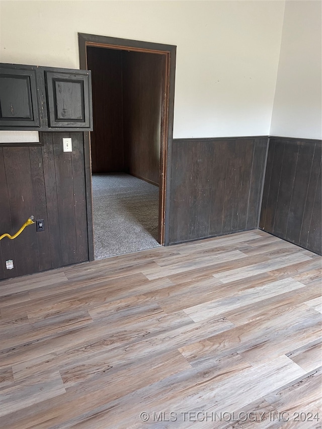 empty room with light hardwood / wood-style flooring