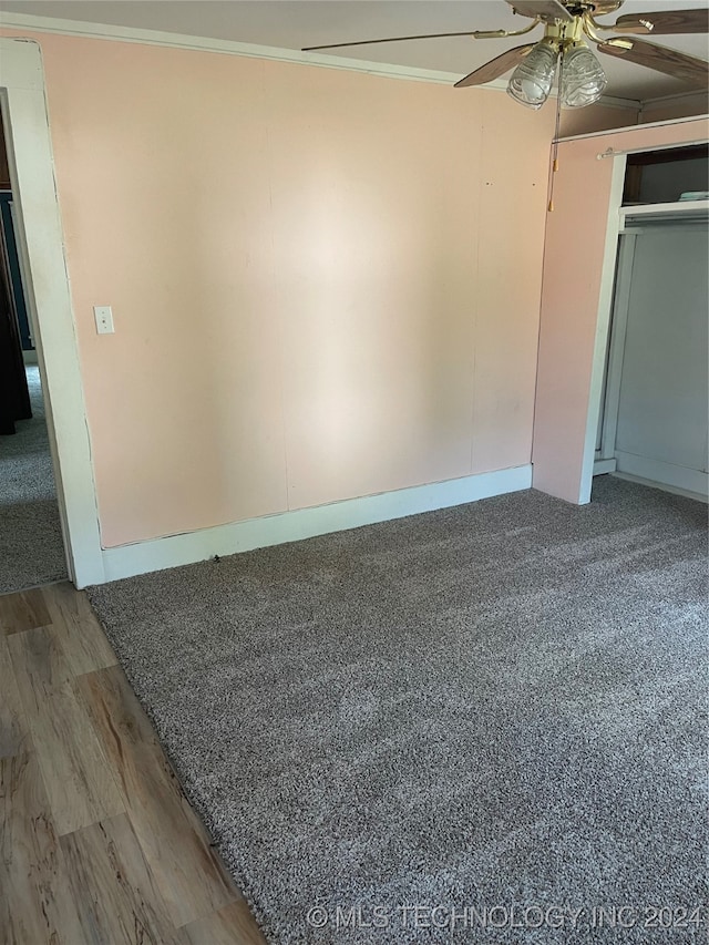 spare room featuring hardwood / wood-style flooring, ceiling fan, and ornamental molding