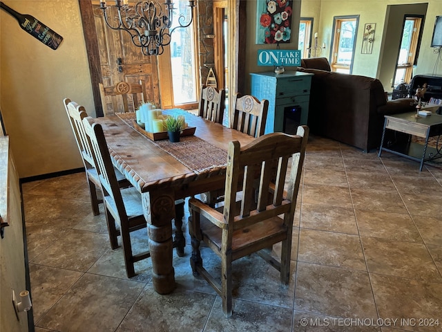 dining area featuring a notable chandelier