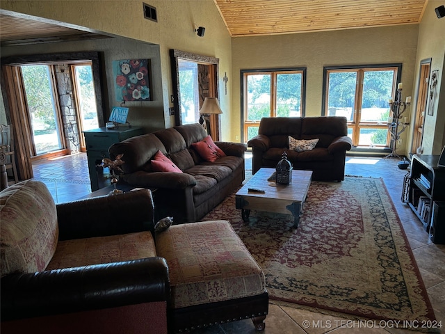 living room featuring wood ceiling and vaulted ceiling