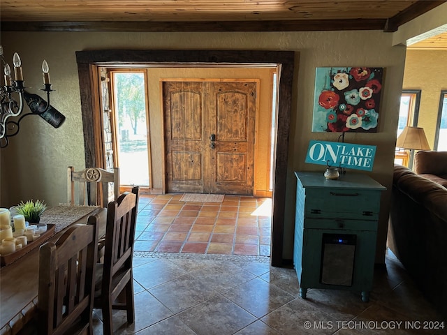 foyer entrance with wood ceiling