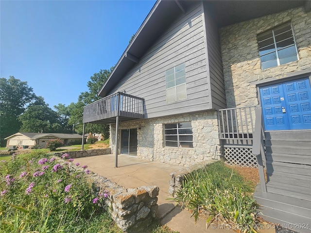 view of home's exterior featuring a patio