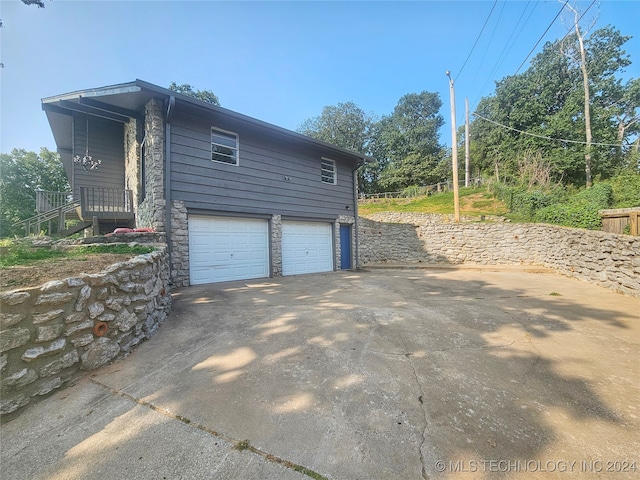 view of property exterior with a garage