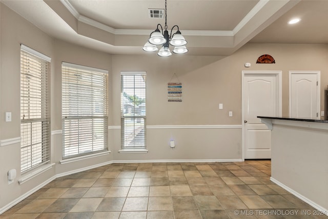 unfurnished dining area with a tray ceiling, light tile patterned floors, a chandelier, and crown molding