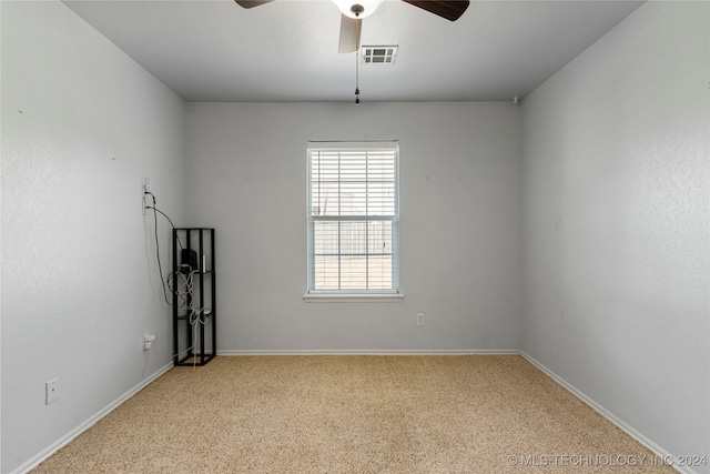 spare room with ceiling fan