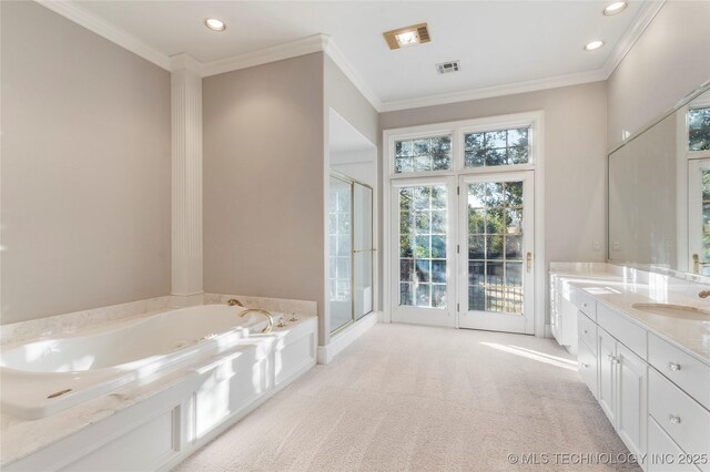 bathroom featuring vanity, crown molding, and plus walk in shower