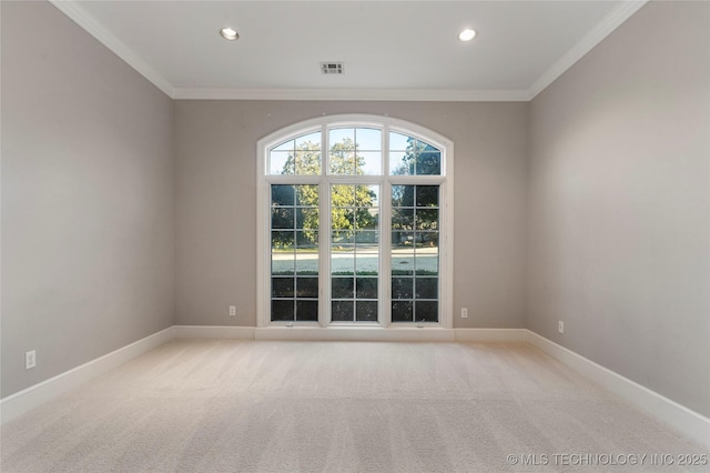 carpeted empty room with crown molding