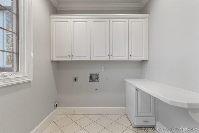 clothes washing area featuring light tile patterned floors, crown molding, electric dryer hookup, hookup for a washing machine, and cabinets