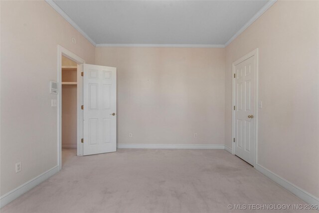 carpeted empty room with ornamental molding