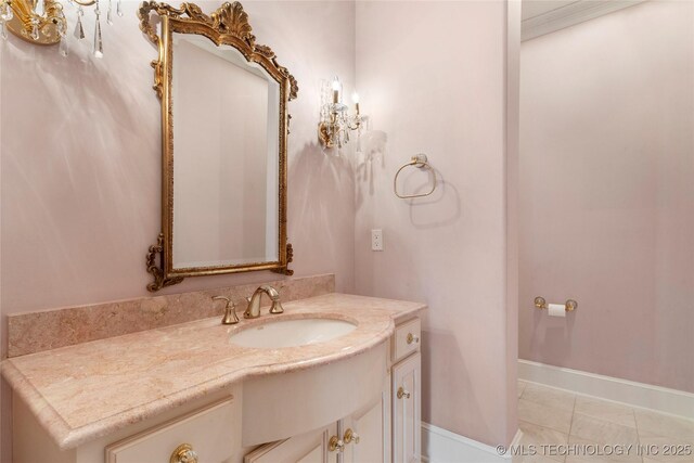 bathroom with tile patterned flooring, vanity, and ornamental molding