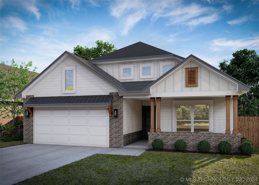 view of front of property with a garage and a front yard