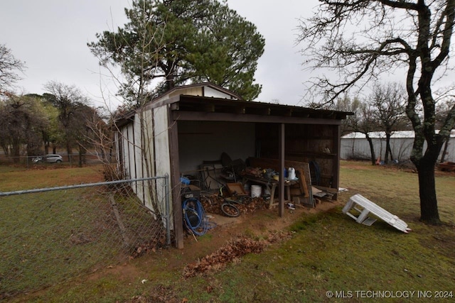 view of outbuilding with a yard