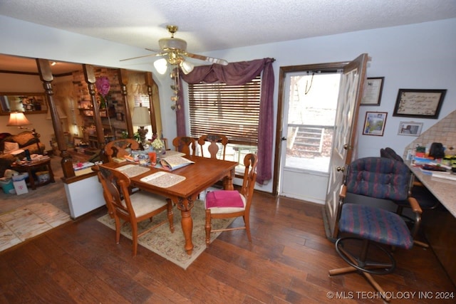 dining space featuring a textured ceiling, ceiling fan, and dark hardwood / wood-style floors