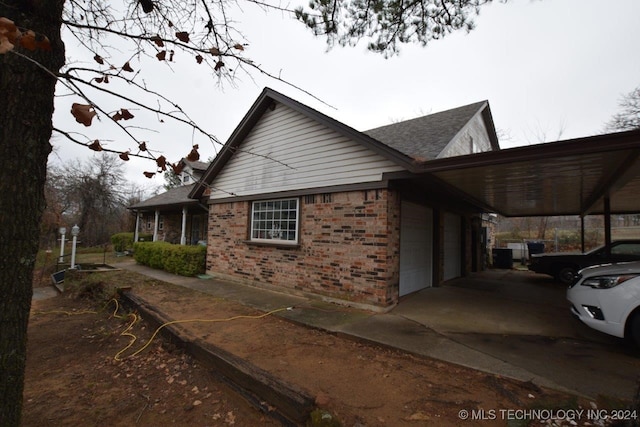 view of property exterior with a garage and a carport