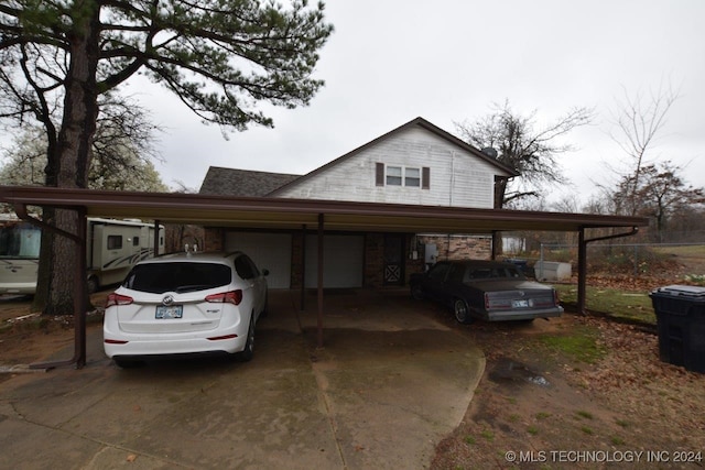 view of side of property featuring a carport