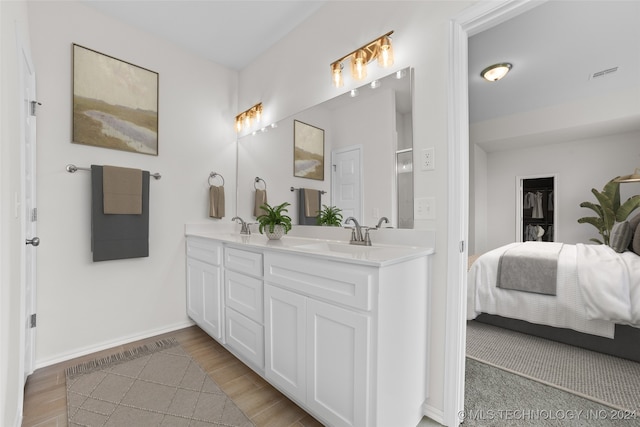 bathroom featuring vanity and hardwood / wood-style flooring