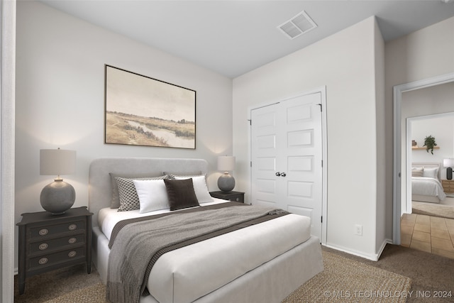 carpeted bedroom featuring a closet