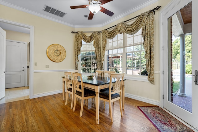 dining area featuring wood-type flooring, ceiling fan, and a wealth of natural light