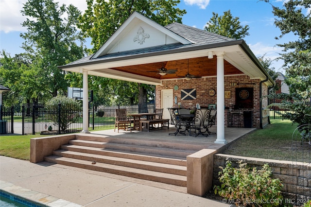 view of community with a lawn and a patio