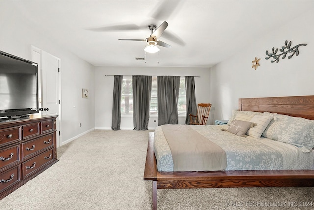 bedroom with light colored carpet and ceiling fan