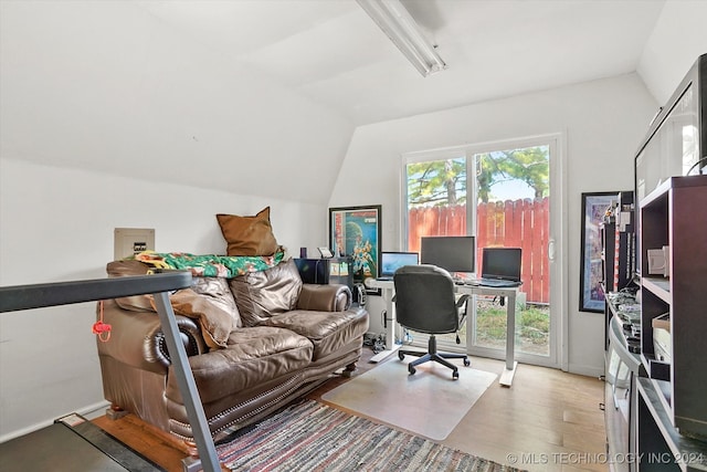 office area with lofted ceiling and light hardwood / wood-style flooring