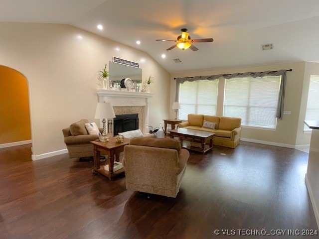 living room featuring dark wood-type flooring, ceiling fan, and lofted ceiling