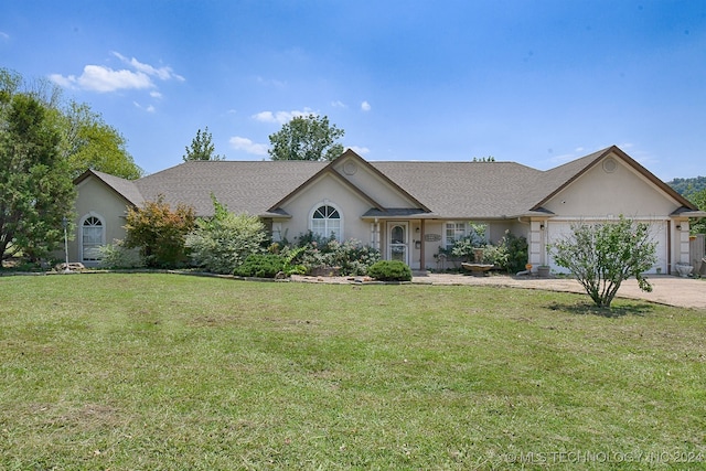 ranch-style home with a front yard and a garage