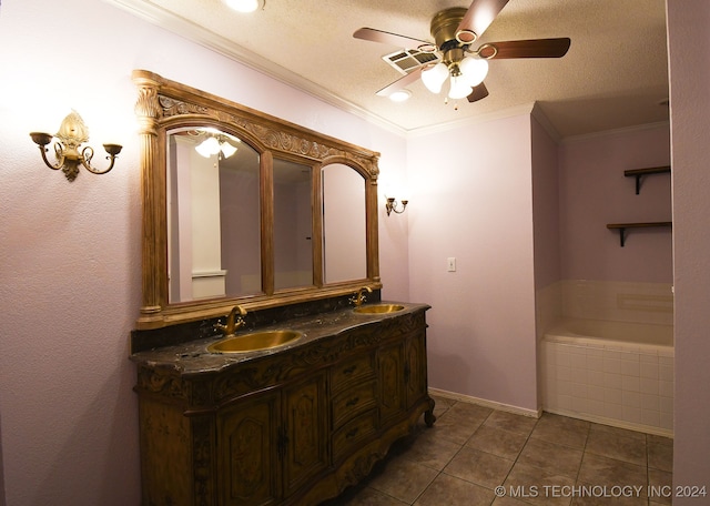 bathroom with a textured ceiling, vanity, tiled bath, tile patterned flooring, and ceiling fan