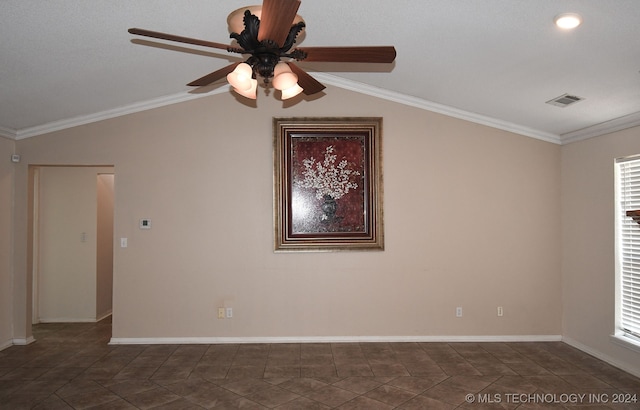 tiled spare room with ceiling fan, vaulted ceiling, and ornamental molding