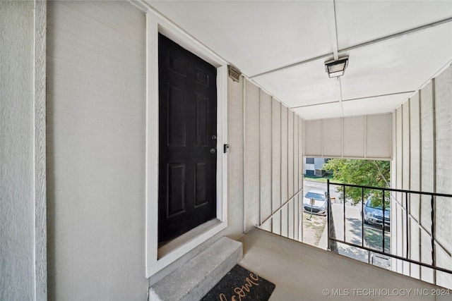 doorway to property featuring a balcony