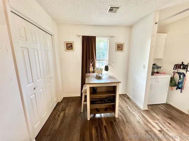 dining area featuring hardwood / wood-style flooring and a textured ceiling