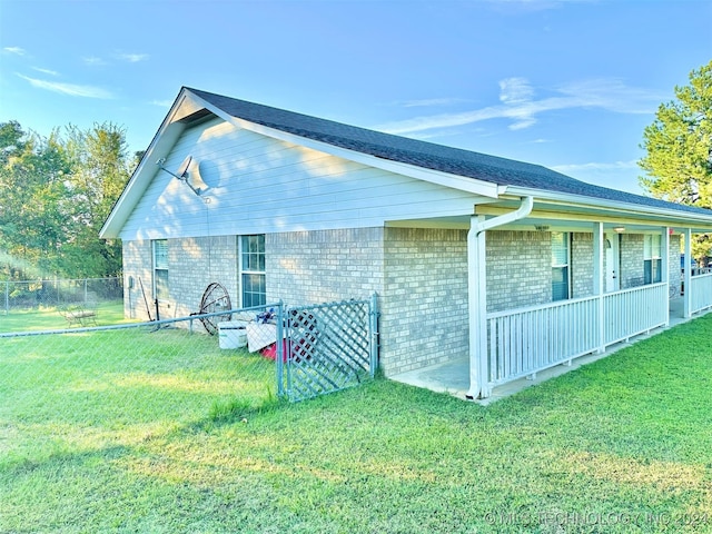 back of house with a lawn