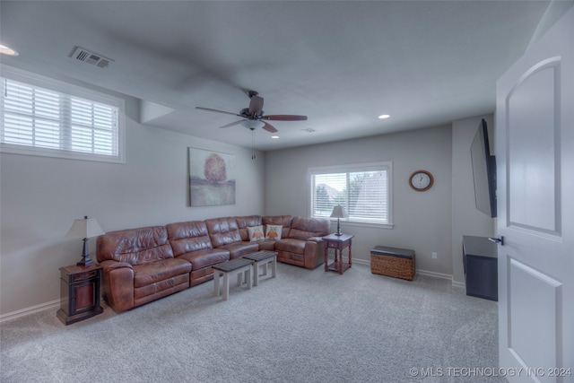 living room with light colored carpet and ceiling fan