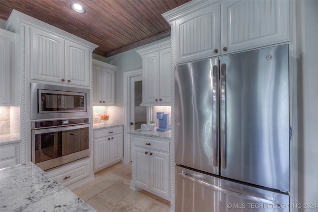 kitchen with white cabinetry, light stone countertops, stainless steel appliances, decorative backsplash, and wood ceiling