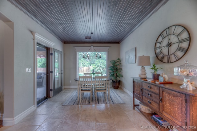 dining space featuring ornamental molding and wood ceiling