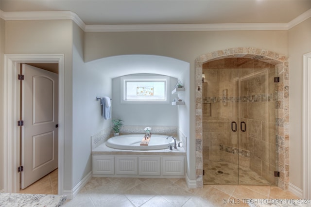 bathroom featuring tile patterned flooring, separate shower and tub, and crown molding