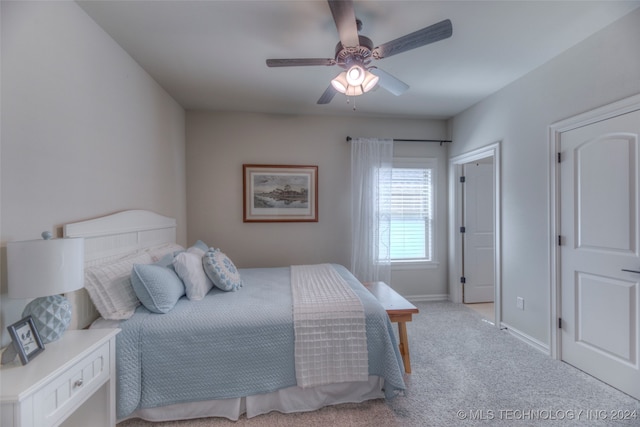 carpeted bedroom with ceiling fan