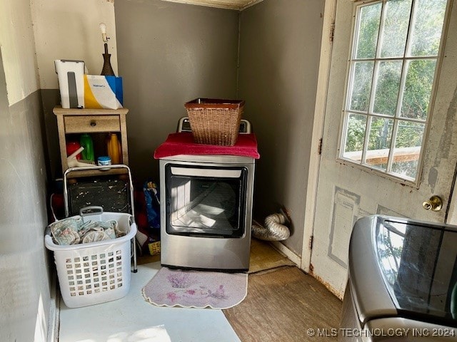 laundry area with hardwood / wood-style flooring