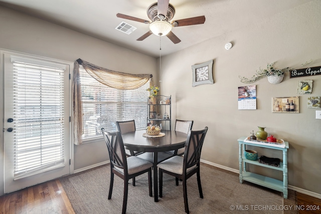 dining area featuring dark hardwood / wood-style floors and ceiling fan