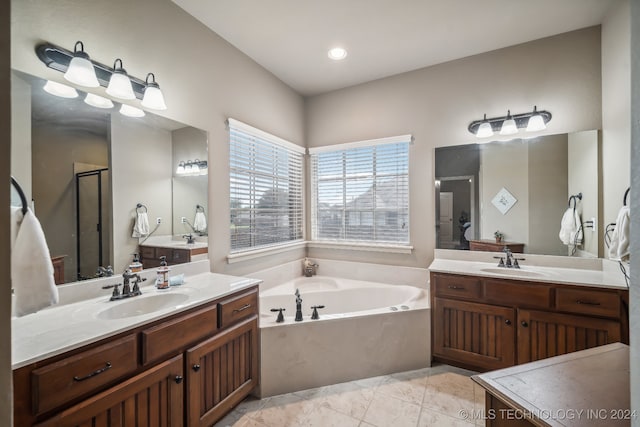 bathroom featuring independent shower and bath and vanity