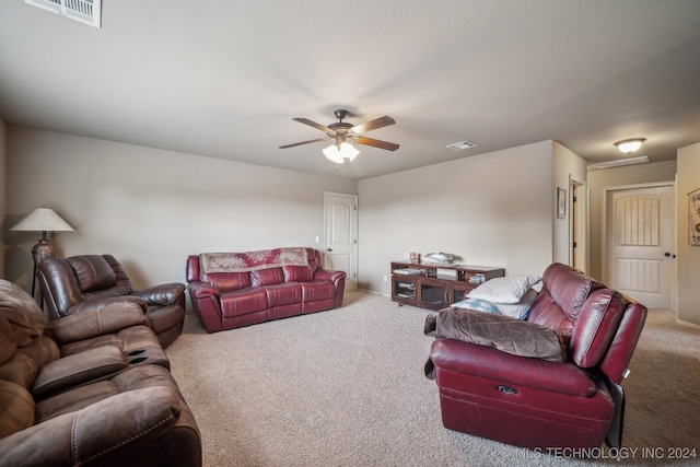 living room featuring carpet flooring and ceiling fan