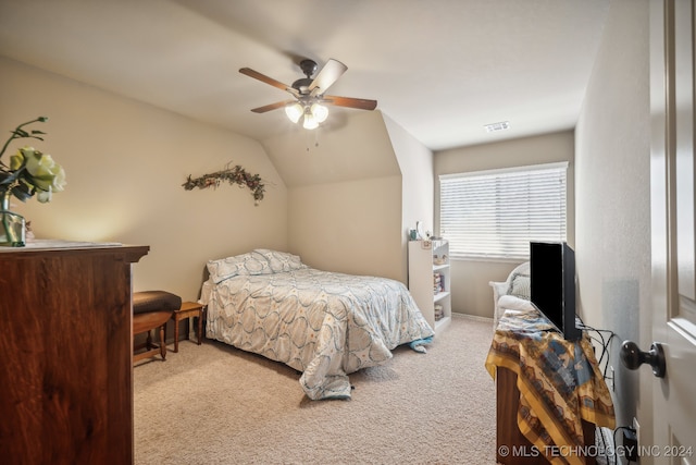 carpeted bedroom featuring ceiling fan and vaulted ceiling