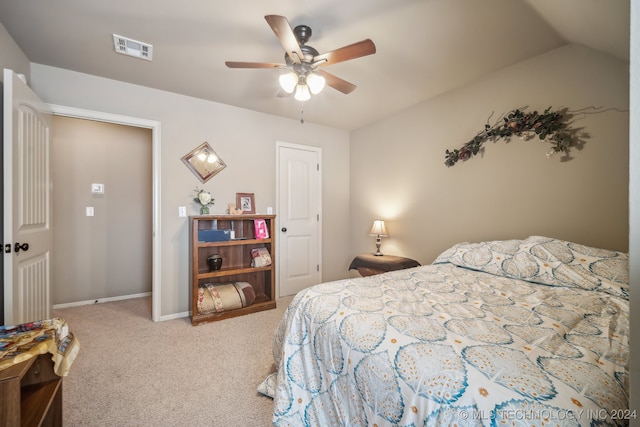 carpeted bedroom featuring ceiling fan and lofted ceiling