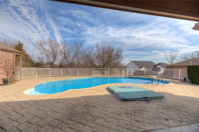 view of swimming pool with a fenced in pool, a patio, and fence