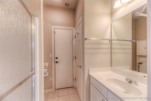 bathroom with tile patterned floors, visible vents, and vanity