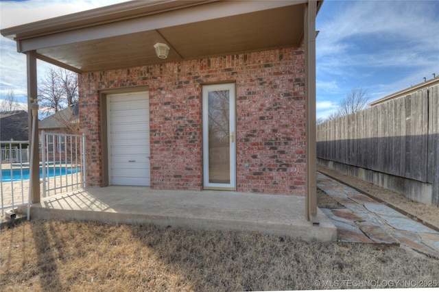 view of patio / terrace with fence and a fenced in pool