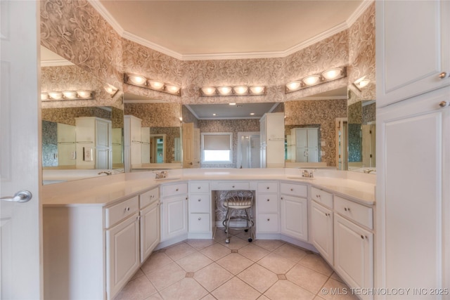 bathroom with wallpapered walls, vanity, tile patterned flooring, and ornamental molding