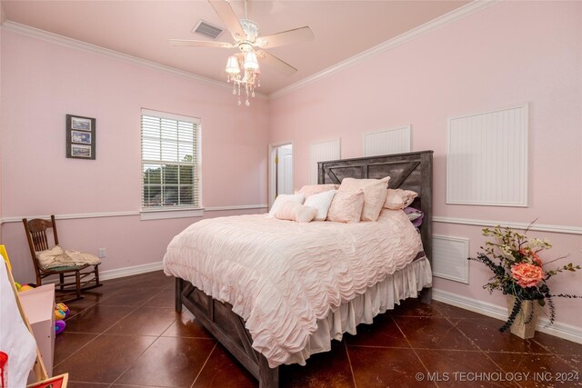 bedroom featuring crown molding, dark tile patterned flooring, baseboards, and visible vents