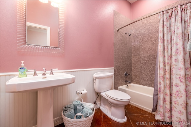 full bathroom featuring toilet, shower / tub combo, sink, and tile patterned flooring