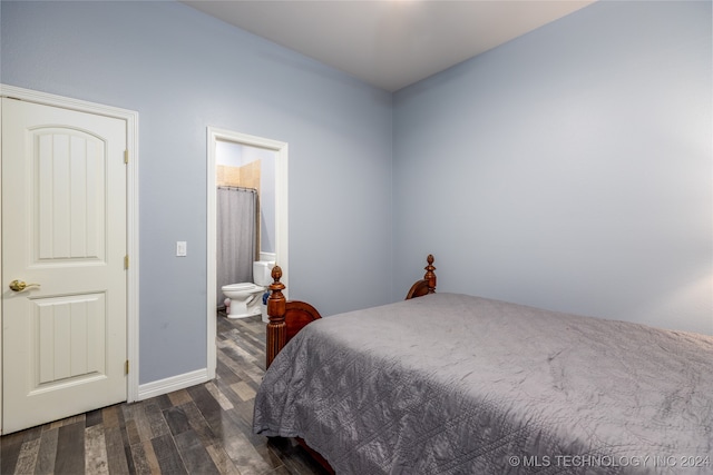 bedroom with dark wood-type flooring and ensuite bath